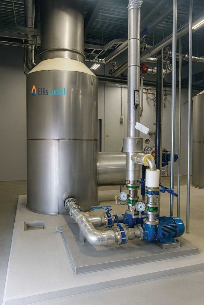 Direct contact water heater installed in an industrial facility with process piping and controls