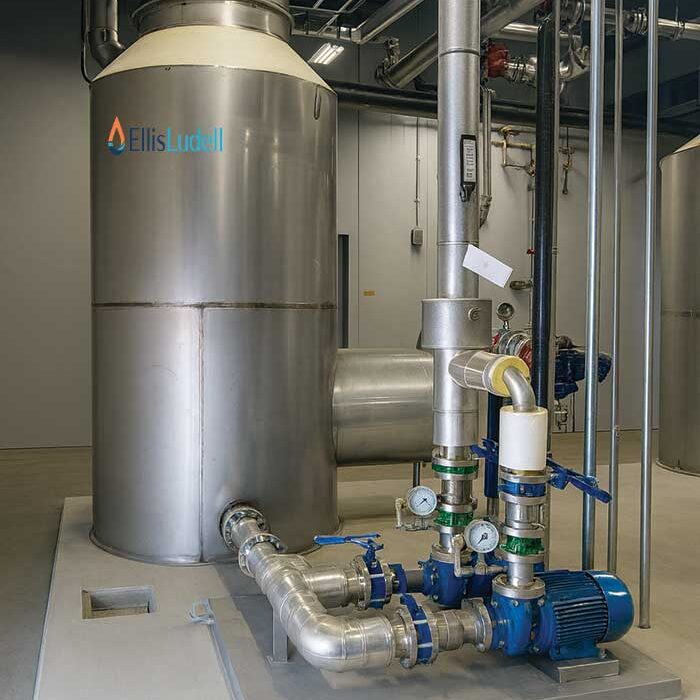 Direct contact water heater installed in an industrial facility with process piping and controls